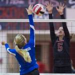 Juneau-Douglas JoJo Griggs, right, attempts a block against Petersburg last season. (Michael Penn | Juneau Empire File)