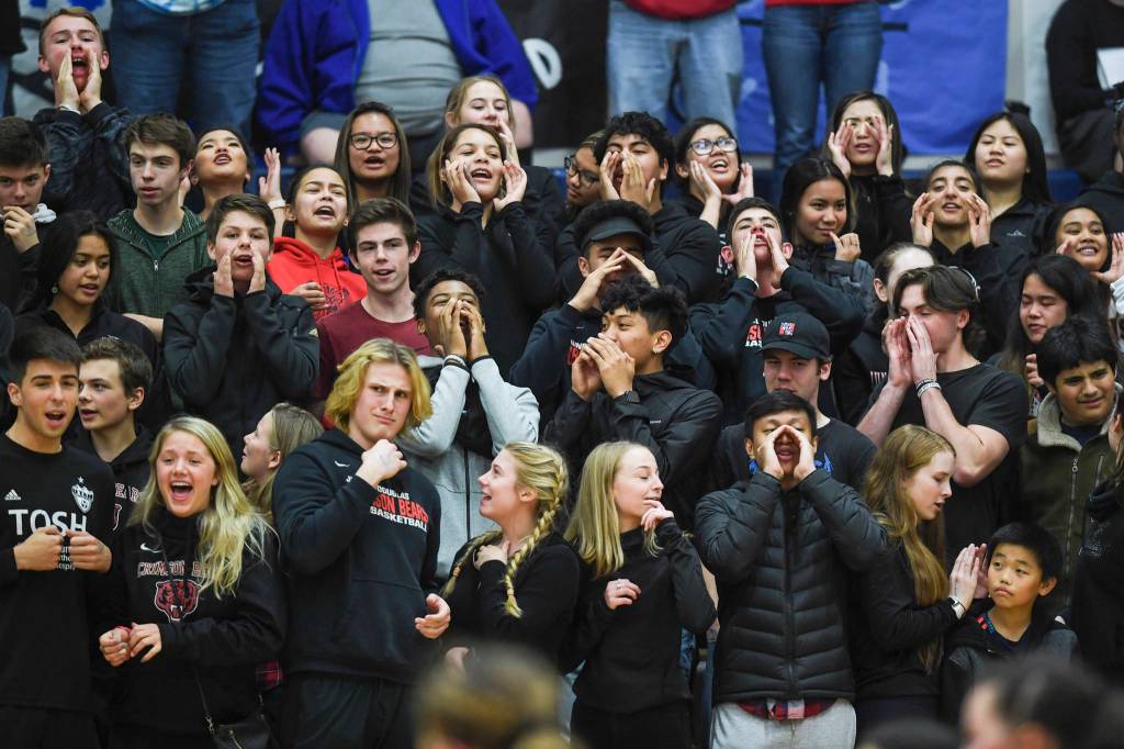 Juneau-Douglas students cheer on their team against Thunder Mountain at Thunder Mountain High School on Friday, Oct. 4, 2019. (Michael Penn | Juneau Empire)