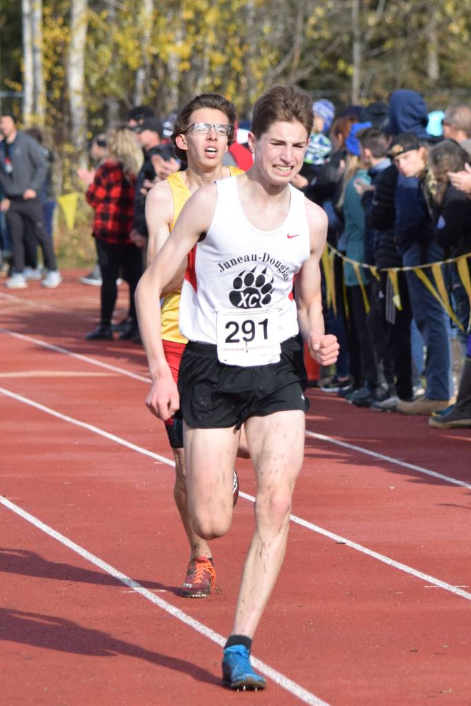 Juneau-Douglas High School: Yadaat.at Kalé junior Finn Morley sprints to the finish line of the ASAA Division I boys cross country championship at Bartlett High School on Saturday, Oct. 5, 2019. Morley placed ninth overall with a time of 16:45. (Nolin Ainsworth | Juneau Empire)
