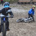 Pearson Fagel, 6, takes a spill at the finish of the Douglas Dirt Derby Youth Bike Race for 5 to 7-year-olds at Savikko Park and the Treadwell Mine Historic Trail on Saturday, Oct. 5, 2019. The event was organized by the Juneau Freewheelers Bicycle Club. (Michael Penn | Juneau Empire)