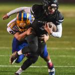 Juneaus Ali Beya is tackled by Bartletts Tairel Tili at Adair-Kennedy Memorial Field on Saturday, Oct. 5, 2019. Juneau won 67-24. (Michael Penn | Juneau Empire)