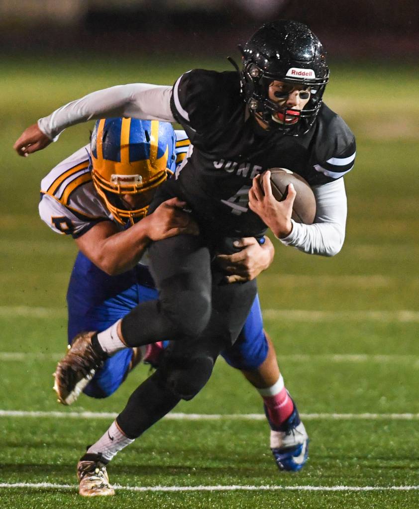 Juneaus Ali Beya is tackled by Bartletts Tairel Tili at Adair-Kennedy Memorial Field on Saturday, Oct. 5, 2019. Juneau won 67-24. (Michael Penn | Juneau Empire)