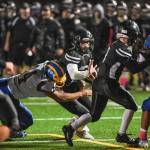 Juneaus Cooper Kriegmont is tackled by Bartletts Tairel Tili at Adair-Kennedy Memorial Field on Saturday, Oct. 5, 2019. Juneau won 67-24. (Michael Penn | Juneau Empire)