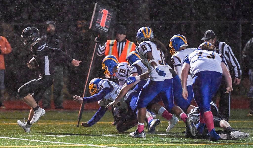 Juneaus Wallace Adams is chase out of bound by Bartlett after a botched field goal attempt at Adair-Kennedy Memorial Field on Saturday, Oct. 5, 2019. Juneau won 67-24. (Michael Penn | Juneau Empire)