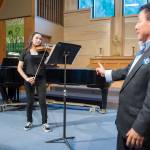 Violin instructor Guo Hua Xia, right, listens as violinist Lisa Eldridge and pianist Kyle Farley-Robinson practice their recital piece at Northern Light United Church in September 2018. Xia will perform in the upcoming Taste of the Season event. (Michael Penn | Juneau)