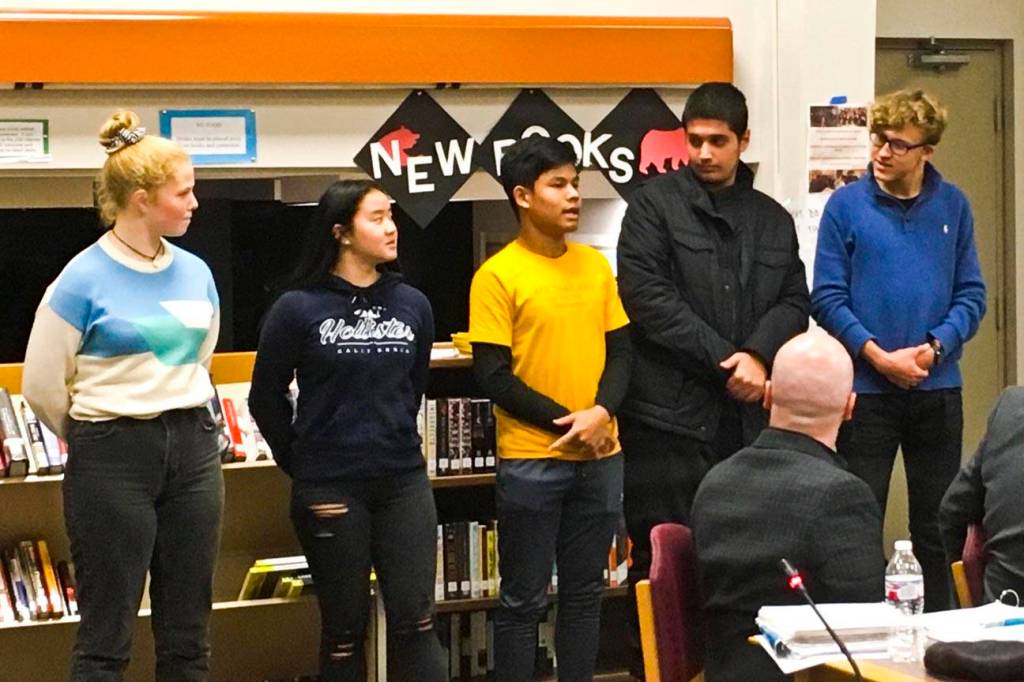 International students from five countries studying abroad in Juneau schools are introduced to the Juneau Board of Education on Oct. 8, 2019. (Michael S. Lockett | Juneau Empire)