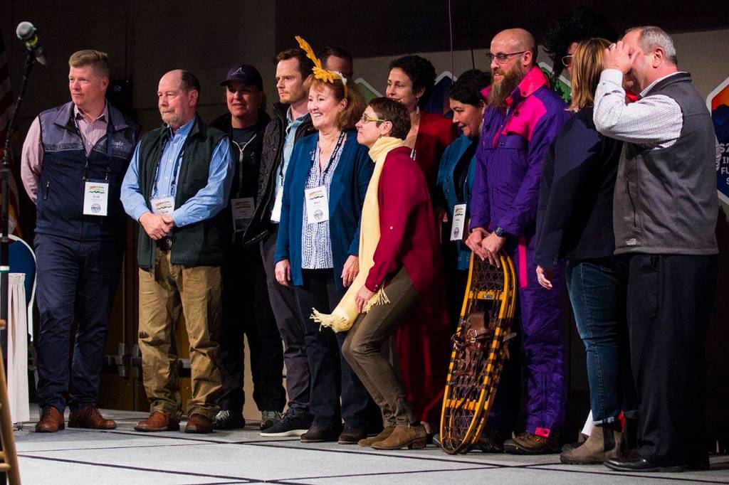 Judges and competitors pose for a photo after participating in the Alaska Tourism Industry Associations version of Shark Tank during their annual conference, held this year at Centennial Center, Oct. 9, 2019. (Michael S. Lockett | Juneau Empire)