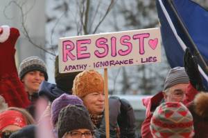 Attendees hold up signs at Juneaus Womens March on Saturday, Jan. 19, 2019. (Alex McCarthy | Juneau Empire)