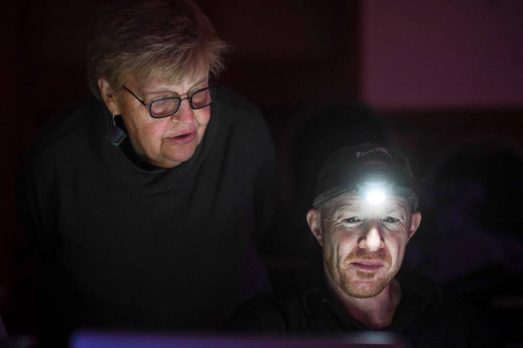 Playwright Maureen Longworth, left, and director Roblin Gray Davis work on the production of Blue Ticket at McPhetres Hall on Tuesday, Oct. 15, 2019. (Michael Penn | Juneau Empire)