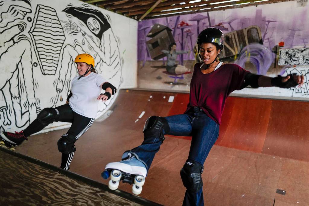 Jennifer Gross and Shabadrang Khalsa, who skate with the Juneau Rollergirls, get their daily skate in at the Pipeline Skate Park on Friday, Oct. 11, 2019. The two are skating every day as part of a challenge to every day for a year. (Michael Penn | Juneau Empire)