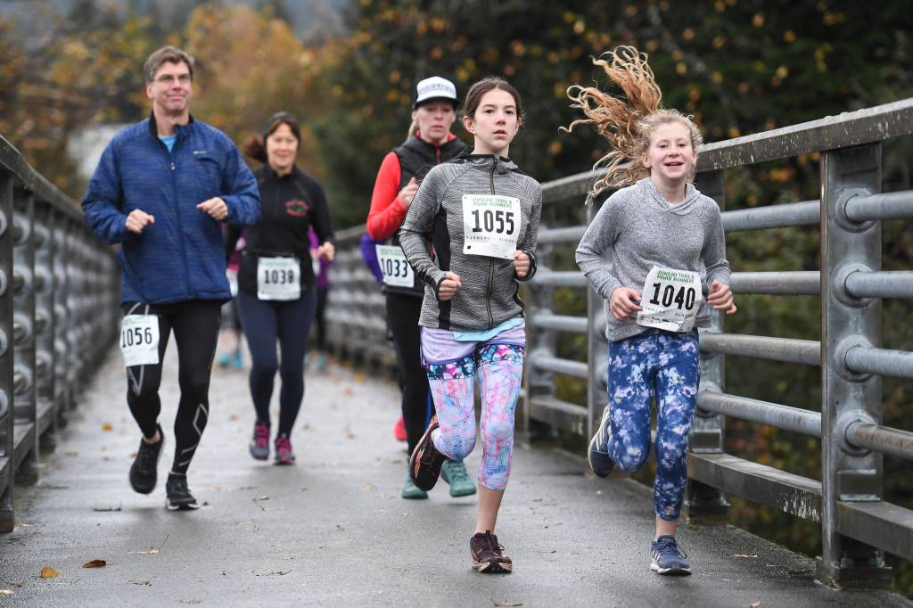 Juneau residents participate in the annual community mental health run, the Extra Tough 5K & 1 Mile Run, on Saturday, Oct. 12, 2019, starting at Riverbend Elementary School. The run is sponsored by National Alliance on Mental Illness (NAMI) Juneau. (Michael Penn | Juneau Empire)