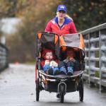 Crystal Schmitz participates with her young children in the annual community mental health run, the Extra Tough 5K & 1 Mile Run, on Saturday, Oct. 12, 2019, starting at Riverbend Elementary School. The run is sponsored by National Alliance on Mental Illness (NAMI) Juneau. (Michael Penn | Juneau Empire)