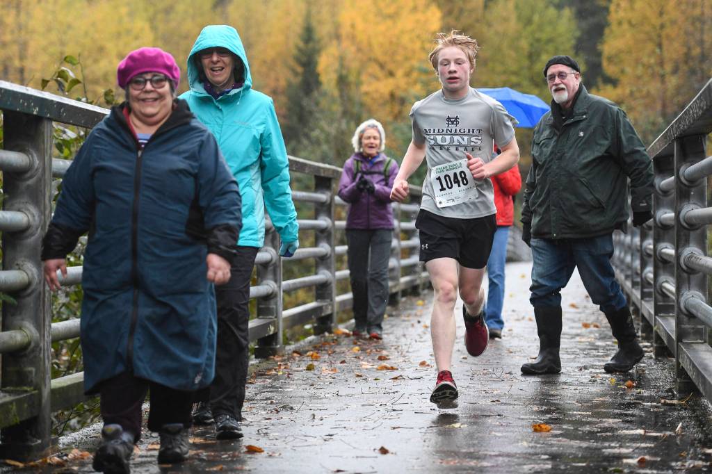 Finn Kesey runs in the annual community mental health run, the Extra Tough 5K & 1 Mile Run, on Saturday, Oct. 12, 2019, at Riverbend Elementary School. The run is sponsored by National Alliance on Mental Illness (NAMI) Juneau. (Michael Penn | Juneau Empire)