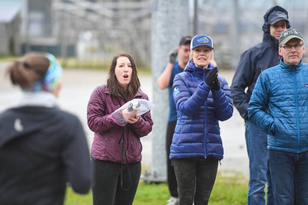 Crystal Bourland, Executive Director of the National Alliance on Mental Illness (NAMI) Juneau, left, cheers and keeps time during the annual community mental health run, the Extra Tough 5K & 1 Mile Run, on Saturday, Oct. 12, 2019, at Riverbend Elementary School. The run is sponsored by National Alliance on Mental Illness (NAMI) Juneau. (Michael Penn | Juneau Empire)