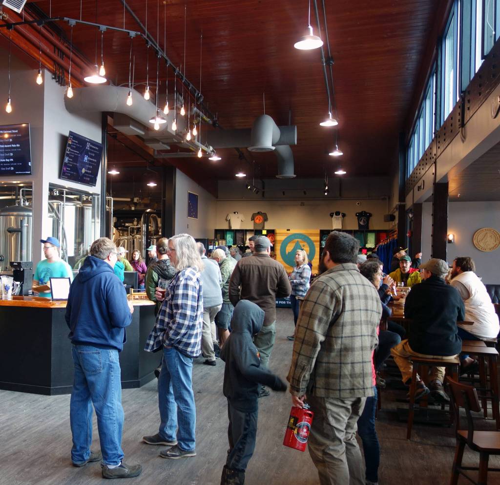 There was a crowd at Forbidden Peak Brewery Saturday, Oct. 12, 2019, for the new Auke Bay business grand opening. (Ben Hohenstatt | Juneau Empire)