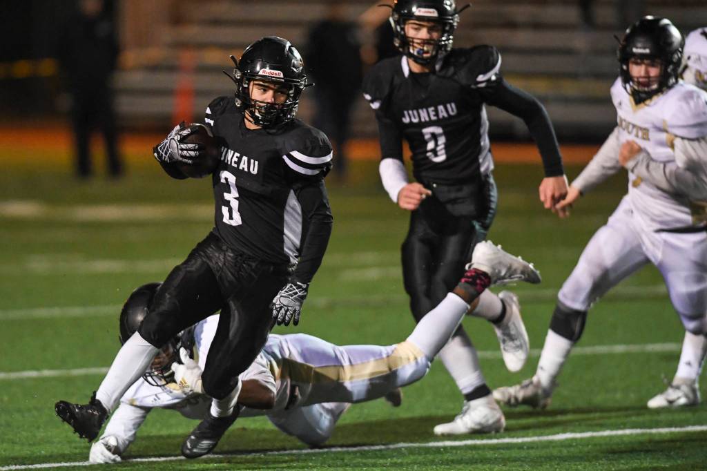 Juneaus Gaby Soto escapes a tackle by a South Anchorage defender at Adair-Kennedy Memorial Field on Saturday, Oct. 12, 2019. South Anchorage won 54-14. (Michael Penn | Juneau Empire)