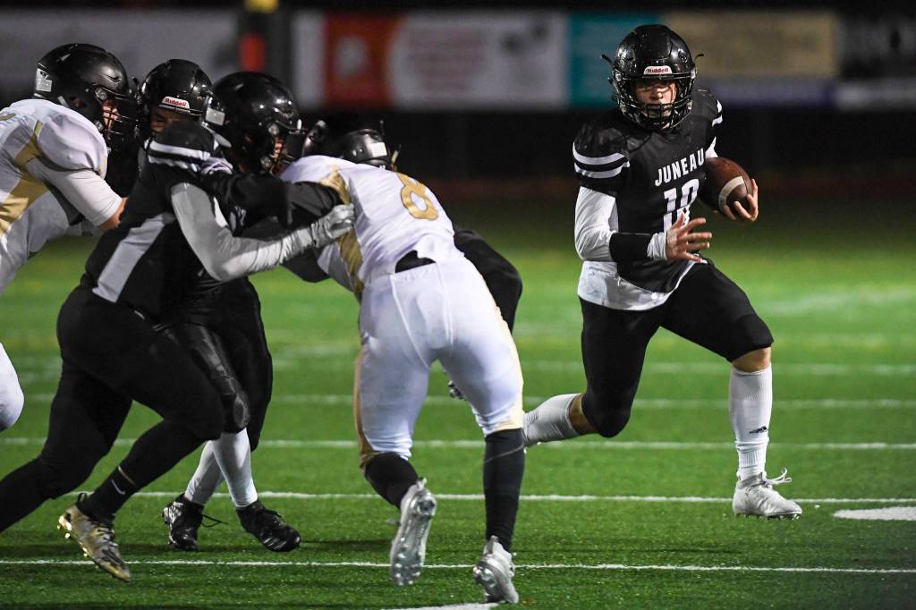 Juneaus quarterback Cooper Kriegmont runs against South Anchorage at Adair-Kennedy Memorial Field on Saturday, Oct. 12, 2019. South Anchorage won 54-14. (Michael Penn | Juneau Empire)