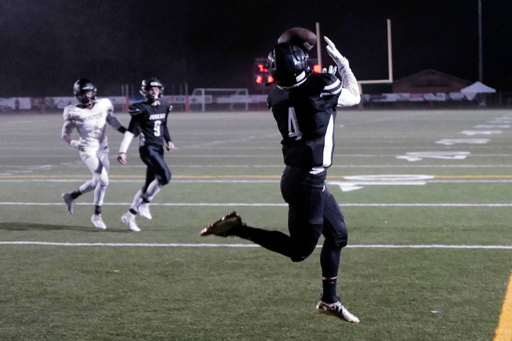 Juneaus Ali Beya catches a Cooper Kriegmont pass in the endzone for Juneaus second touchdown against South Anchorage at Adair-Kennedy Memorial Field on Saturday, Oct. 12, 2019. South Anchorage won 54-14. (Michael Penn | Juneau Empire)