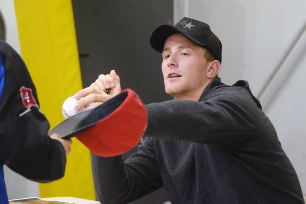 Cleveland Indians pitcher Zach Plesac signs autographs for Midnight Suns Baseball Club players at the Wells Fargo Dimond Park Field House on Thursday, Oct. 17, 2019. (Nolin Ainsworth | Juneau Empire)