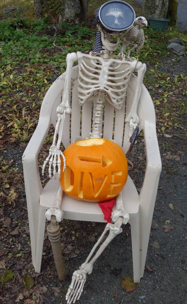 A pumpkin-clutching skeleton marks the way to the dive at the sixth annual Spooktacular Dive and Underwater Pumpkin Carving event Saturday, Oct. 26, 2019. (Ben Hohenstatt | Juneau Empire)