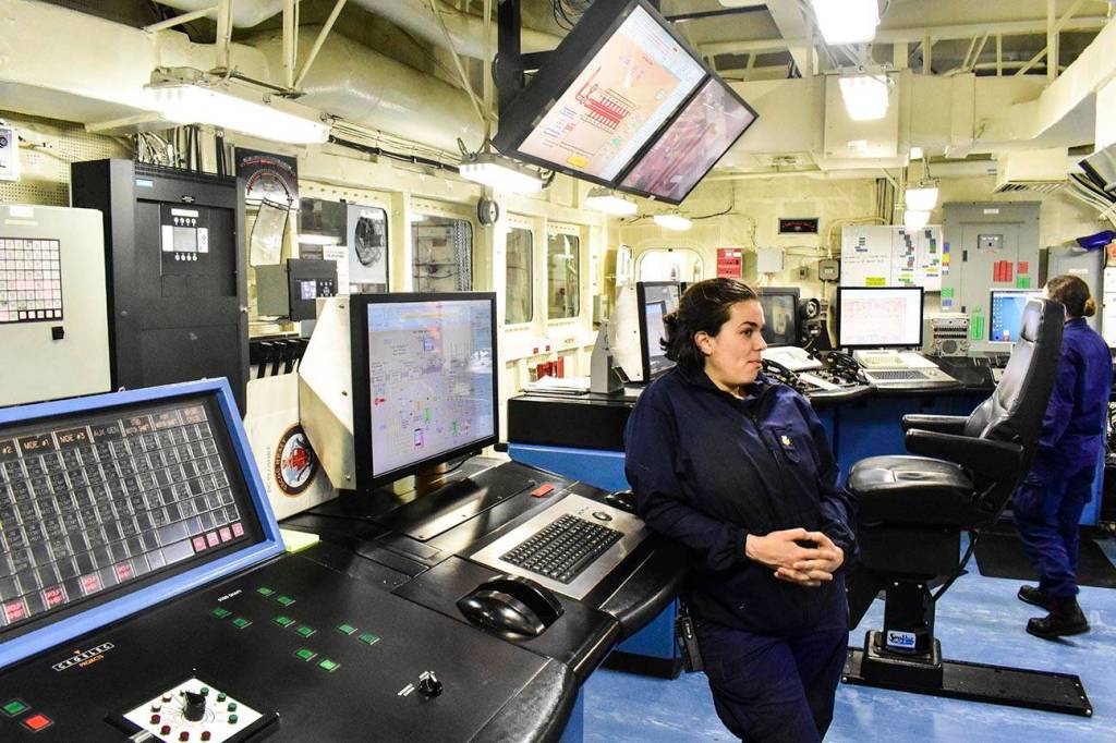 Petty Officer 1st Class Camille Sutton, a machinery technician aboard USCGC Healy, the Coast Guards only medium icebreaker, shows off the engine room as Healy returns to Seattle at the end of a three month deployment, Oct. 27, 2019. (Peter Segall | Juneau Empire)