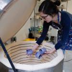Mercedes Muñoz takes ceramic cups out of her home studio kiln on Monday, Oct. 28, 2019, as she prepares for a First Friday show at Coppa. (Michael Penn | Juneau Empire)