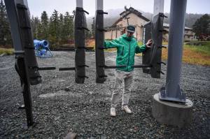 Charlie Herrington, Marketing Manager for the Eaglecrest Ski Area, shows off new radio-frequency identification gates on Tuesday, Oct. 29, 2019, that skiers will use this season to access the chairlifts. (Michael Penn | Juneau Empire)