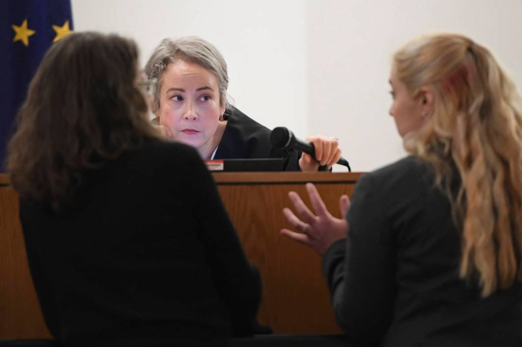 Juneau Superior Court Judge Amy Mead, center, listens to Assistant Attorney General Lisa Kelley, right, and Public Defender Agencys Deborah Macaulay during the trial of Loretto Lee Jones in Juneau Superior Court on Thursday, Oct. 31, 2019. Jones is on trial for Alaska Permanent Fund Dividend felony theft and fraud. The two charges stem from allegations that Jones filed for her PFD payout in 2016 while having resided outside the state for more than 180 days. (Michael Penn | Juneau Empire)