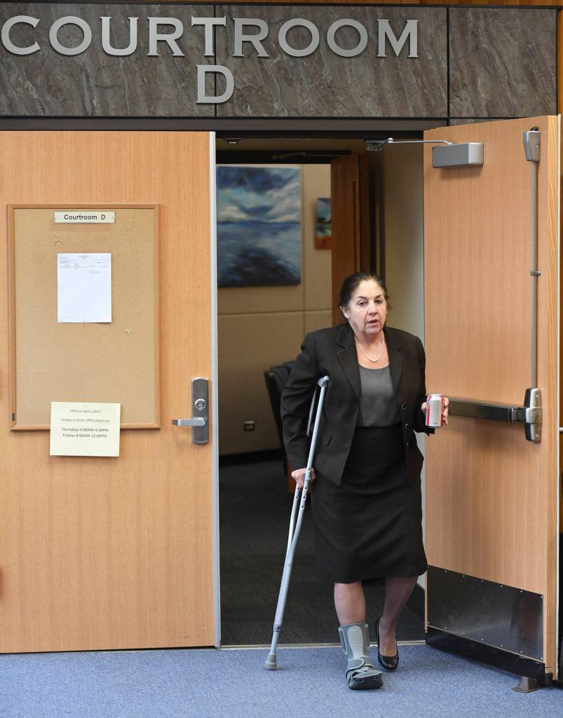 Loretto Lee Jones, 65, walks out of Juneau Superior Court during a break on Thursday, Oct. 31, 2019. Jones is on trial for Alaska Permanent Fund Dividend felony theft and fraud. The two charges stem from allegations that Jones filed for her PFD payout in 2016 while having resided outside the state for more than 180 days. (Michael Penn | Juneau Empire)