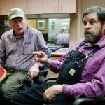 Joe Emerson, left, and Keith Heller, of Shoreline Wild Salmon, talk Thursday, Oct. 31, 2019, about their new business delivering troll-caught salmon to both local and out-of-state markets. (Michael Penn | Juneau Empire)