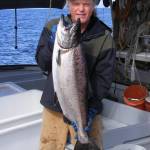 Joe Emerson, co-owner of Shoreline Wild Salmon, holds up a salmon. (Courtesy Photo | Joe Emerson)