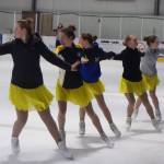 Team Forget Me Not, a synchronized figure skating team, practices before a performance at Treadwell Arena, Saturday, Nov. 2, 2019. Toward the end of the practice session, team members donned jackets. (Ben Hohenstatt | Juneau Empire)