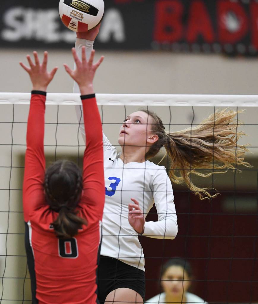 Thunder Mountains Lily Smith spikes the ball against Juneau-Douglas Addie Prussing at Juneau-Douglas High School: Yadaa.at Kalé on Friday, Nov. 1, 2019. Thunder Mountain won 3-0 (25-14, 25-20, 25-20). (Michael Penn | Juneau Empire)
