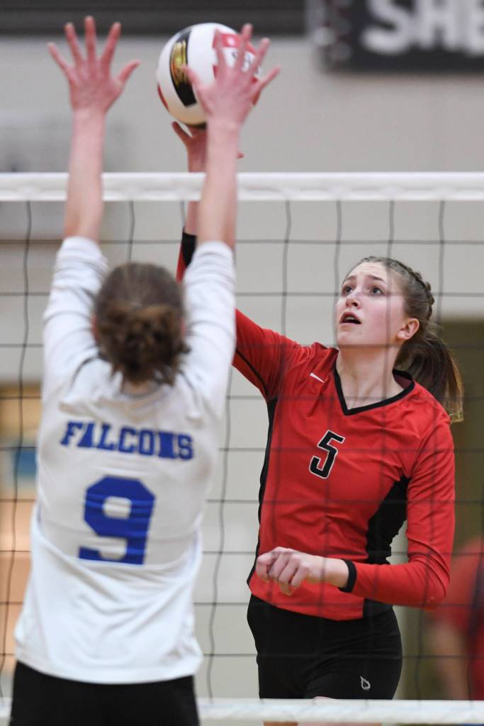 Juneau-Douglas Brooke Sanford, right, spikes against Thunder Mountains Sophie Harvey at Juneau-Douglas High School: Yadaa.at Kalé on Friday, Nov. 1, 2019. Thunder Mountain won 3-0 (25-14, 25-20, 25-20). ( Michael Penn | Juneau Empire)