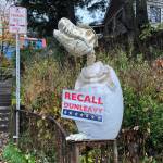 In this Friday, Nov. 1 photo, a sign reading Recall Dunleavy hangs from a decoration in front of a yard near the Alaska governors mansion in Juneau. A fight is brewing in the state over whether Republican Gov. Mike Dunleavy should be recalled from office, with his critics saying hes incompetent and has recklessly tried to cut spending while supporters see a politically motivated attempt to undo the last election. (AP Photo | Becky Bohrer)
