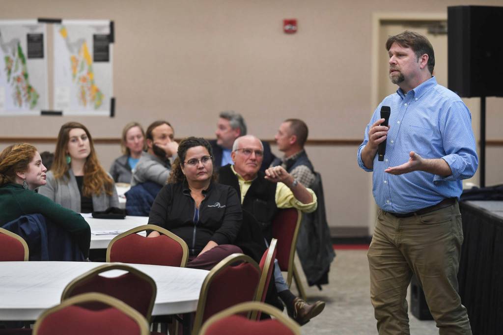 Juneau residents listen to a U.S. Department of Agriculture Forest Service informational meeting lead by National Forest System Deputy Chief Chris French on the Rulemaking for Alaska Roadless Areas Draft Environmental Impact Statement at Elizabeth Peratrovich Hall on Monday, Nov. 4, 2019. (Michael Penn | Juneau Empire)