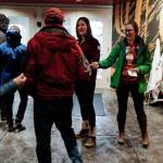 Meredith Trainor, Executive Director of the southeast Alaska Conservation Council, center, and Maggie Rabb, Development and Operations Director for SEACC, handout materials to Juneau residents as they arrive for a U.S. Department of Agriculture Forest Service informational meeting on the Rulemaking for Alaska Roadless Areas Draft Environmental Impact Statement at Elizabeth Peratrovich Hall on Monday, Nov. 4, 2019. (Michael Penn | Juneau Empire)