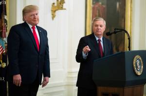 President Donald Trump listens to Sen. Lindsey Graham, R-S.C., speak during a ceremony in the East Room of the White House where Trump spoke about his judicial appointments, Wednesday, Nov. 6, 2019, in Washington. (AP Photo | Manuel Balce Ceneta)