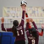 Juneau-Douglas Jenae Pusich tips the ball against Ketchikans Lindsey Byron, left, and Maddy Purcell during the Region V Volleyball Tournament at Thunder Mountain High School on Thursday, Nov. 7, 2019. JDHS won 25-8, 25-14, 14-25, 25-15. (Michael Penn | Juneau Empire)