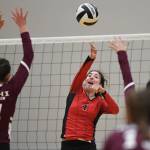 Juneau-Douglas Jenae Pusich spikes the ball against Ketchikans Lindsey Byron, left, and Maddy Purcell during the Region V Volleyball Tournament at Thunder Mountain High School on Thursday, Nov. 7, 2019. JDHS won 25-8, 25-14, 14-25, 25-15. (Michael Penn | Juneau Empire)