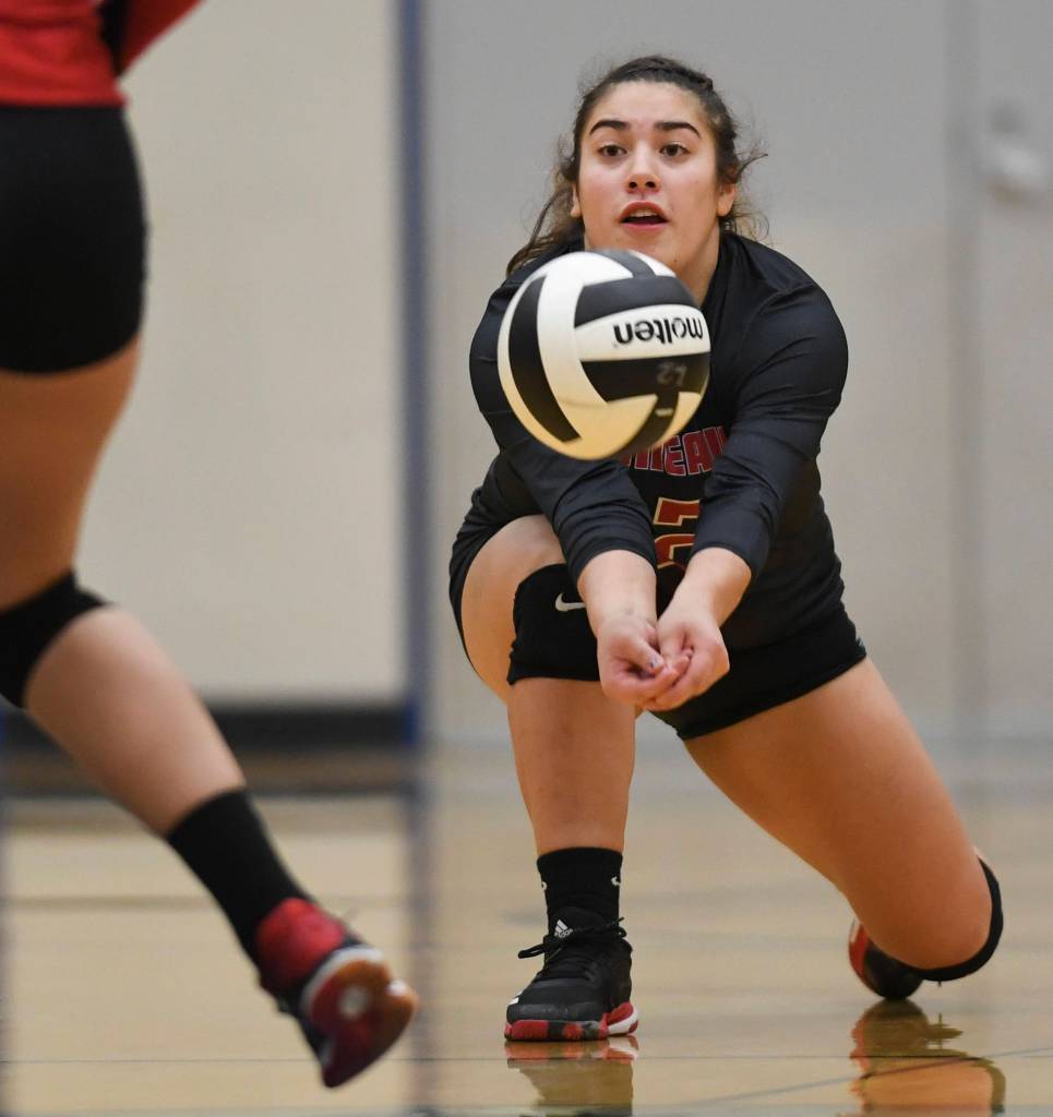 Juneau-Douglas Paige Adams bumps the ball up against Ketchikan during the Region V Volleyball Tournament at Thunder Mountain High School on Thursday, Nov. 7, 2019. JDHS won 25-8, 25-14, 14-25, 25-15. (Michael Penn | Juneau Empire)