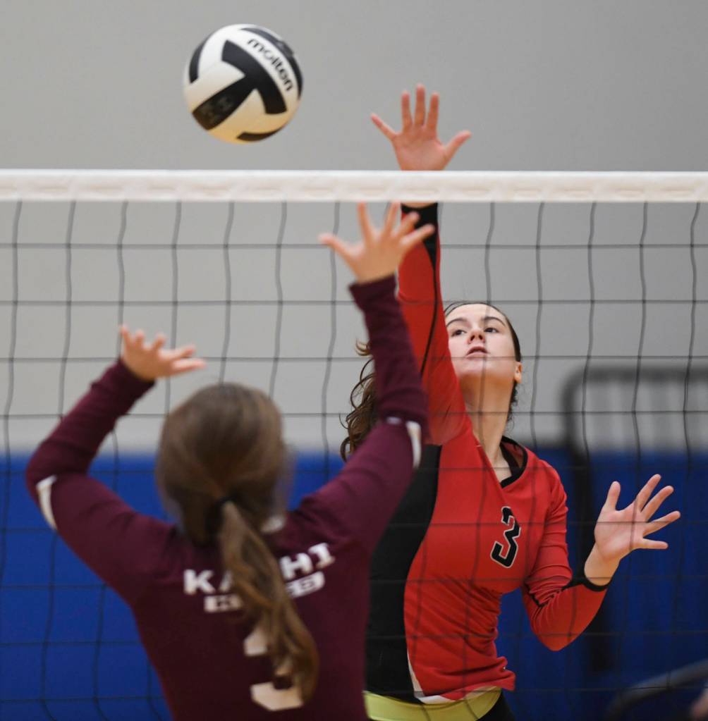 Juneau-Douglas Abby Dean spikes against Ketchikans Janae Rhodes during the Region V Volleyball Tournament at Thunder Mountain High School on Thursday, Nov. 7, 2019. JDHS won 25-8, 25-14, 14-25, 25-15. (Michael Penn | Juneau Empire)