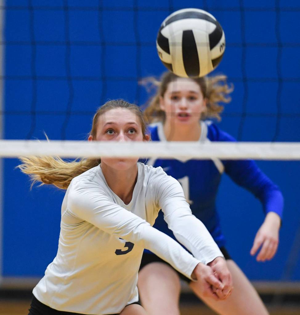 Thunder Mountains Lily Smith bumps the ball up against Juneau-Douglas during the Region V Volleyball Tournament at Thunder Mountain High School on Friday, Nov. 8, 2019. JDHS won 25-22, 26-24, 25-20. (Michael Penn | Juneau Empire)