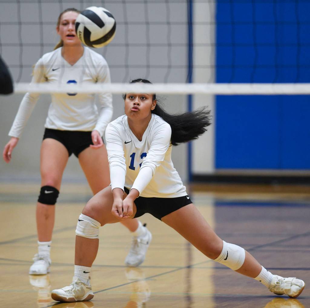 Thunder Mountains Mariah Tanuvasa-Tuvaifale bumps the ball up against Juneau-Douglas during the Region V Volleyball Tournament at Thunder Mountain High School on Friday, Nov. 8, 2019. JDHS won 25-22, 26-24, 25-20. (Michael Penn | Juneau Empire)