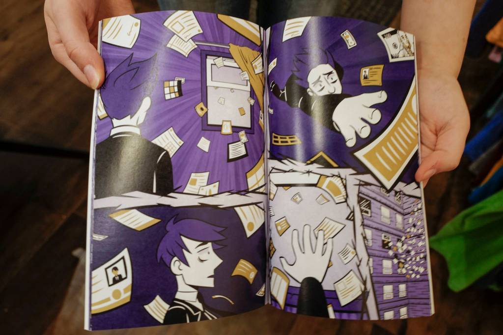 Claire Scott, 16, a junior at Juneau-Douglas High School: Yadaa.at Kalé, shows off her second published comic book, A Most Peculiar Alarm Clock, at Alaska Robotics Gallery on Tuesday, Nov. 12, 2019. Scotts first book, Meow Cats United, was published last year. (Michael Penn | Juneau Empire)