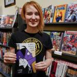 Claire Scott, 16, a junior at Juneau-Douglas High School: Yadaa.at Kalé, shows off her second published comic book, A Most Peculiar Alarm Clock, at Alaska Robotics Gallery on Tuesday, Nov. 12, 2019. Scotts first book, Meow Cats United, was published last year. (Michael Penn | Juneau Empire)