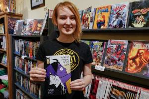 Claire Scott, 16, a junior at Juneau-Douglas High School: Yadaa.at Kalé, shows off her second published comic book, A Most Peculiar Alarm Clock, at Alaska Robotics Gallery on Tuesday, Nov. 12, 2019. Scotts first book, Meow Cats United, was published last year. (Michael Penn | Juneau Empire)