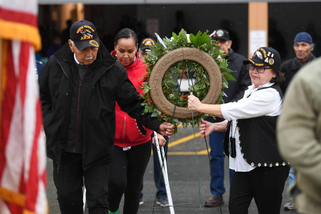 Southeast Alaska Native Veterans Ray Wilson, left, Tamera Paul, center, and Val Cooday place a wreath during the Veterans Day Ceremony at the SE Alaska Native Veterans Park on Monday, Nov. 11, 2019. (Michael Penn | Juneau Empire)