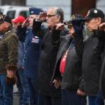 Veterans salute during the Veterans Day Ceremony at the SE Alaska Native Veterans Park on Monday, Nov. 11, 2019. (Michael Penn | Juneau Empire)
