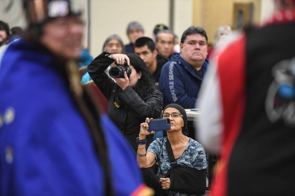 Juneau residents watch the Yaaw Tei Yi Dance Group perform during the Southeast Alaska Native Veterans Veterans Day luncheon at the Elizabeth Peratrovich Hall on Monday, Nov. 11, 2019. (Michael Penn | Juneau Empire)